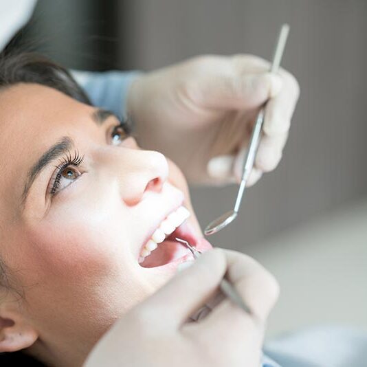 young woman having dental checkup