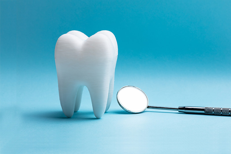 3d tooth and mirror on blue background